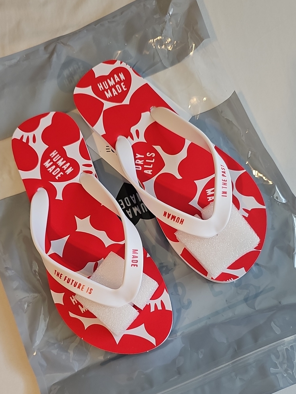 BRAND NEW Human Made Red & White Flip Flops
